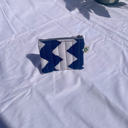 Flat handmade pouch made from upcycled and secondhand fabrics
