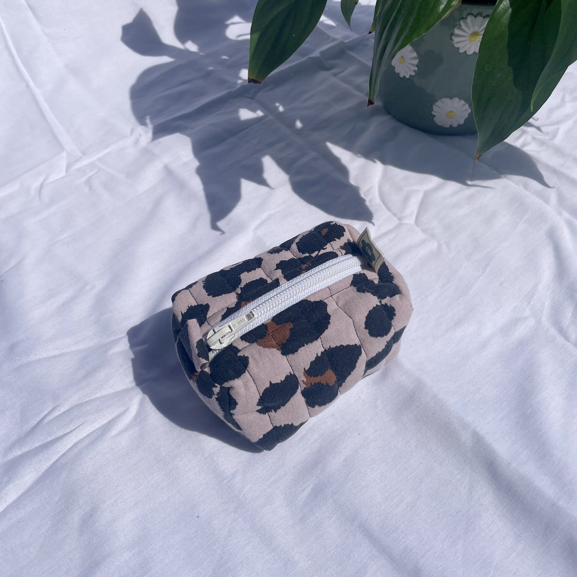 Small handmade toiletry bag made from upcycled and secondhand fabrics