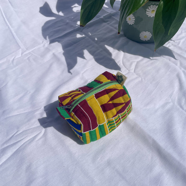 Small handmade toiletry bag made from upcycled and secondhand fabrics
